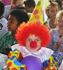 We love books Elise with her colourful clown costume.